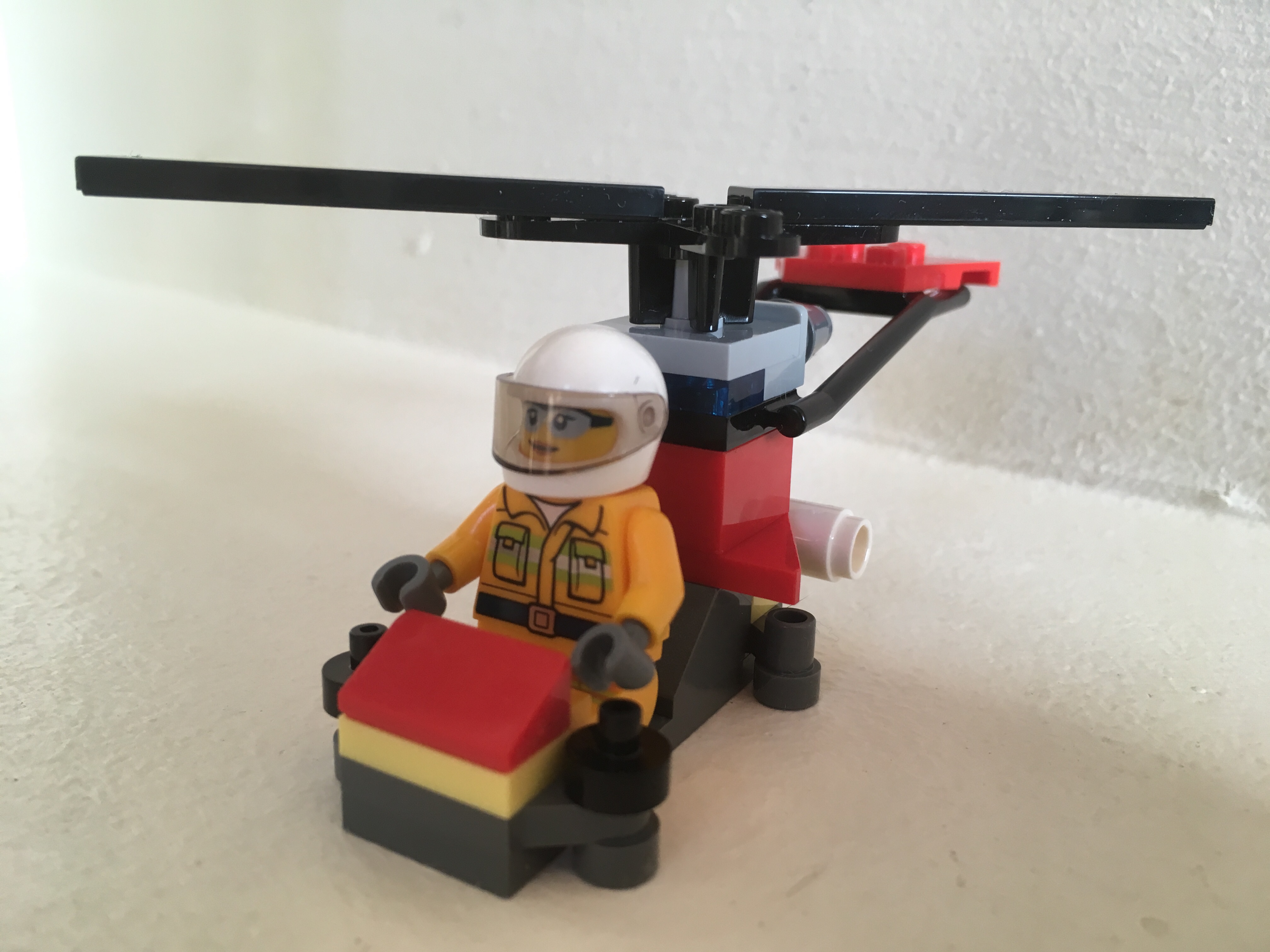 Lego Firefighter Minifigure with helicopter